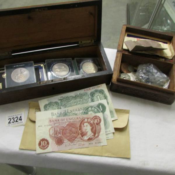 A collections of assorted coins and bank notes including Churchill crowns, other crowns etc.