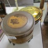 A copper warming pan, a brass trivet and a wooden trinket box.