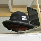 An Ace brand bowler hat, size 7 and 7/8 inches.