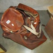 A leather holdall and one other.