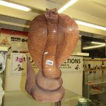 A large carved wood cobra.