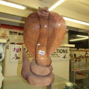 A large carved wood cobra.