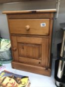 A pine bedside cabinet