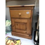 A pine bedside cabinet