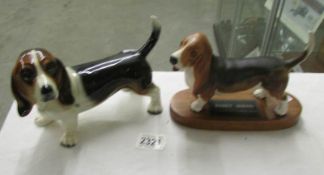 A Beswick Basset hound figure on plinth and a second Basset hound figure in the style of Beswick.