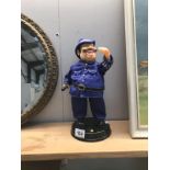 A laughing policeman musical figurine