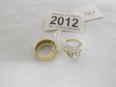 A 9ct gold wedding ring, size M and another 9ct gold ring, size K.