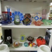 2 shelves of assorted coloured glass.