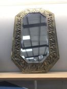 A gilt framed mirror