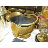 A brass coal scuttle