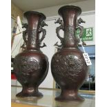A pair of 19th century oriental bronze dragon vases.