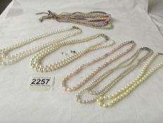 5 assorted pearl and simulated pearl necklaces (one with 9ct gold clasp) and another necklace (a/f).