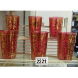 A set of 6 gold decorated cranberry glass tumblers.