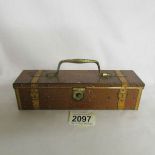 A Huntley & Palmers biscuit tin in the shape of a suitcase.