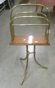 A vintage brass and wood magazine rack.