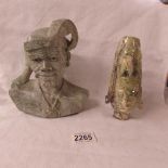 2 carved stone busts.