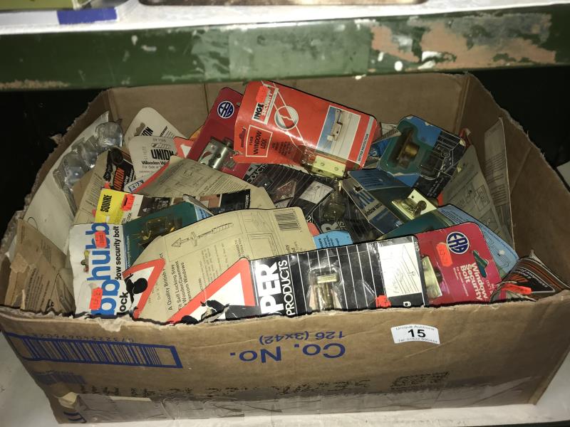 A box of window catches, locks etc.