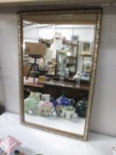 A gilt framed mirror