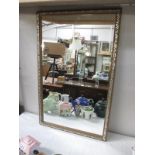 A gilt framed mirror