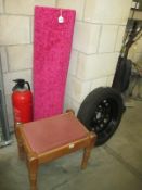 A pink rug and stool with pink cushion top