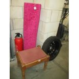 A pink rug and stool with pink cushion top