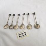 A set of 6 silver spoons with coffee bean finials.