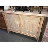 A bamboo bergere 2 door cupboard