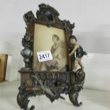 An Edwardian cold painted spelter photograph frame.