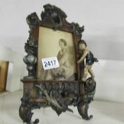 An Edwardian cold painted spelter photograph frame.