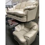 A cream leather 3 seater settee and one chair