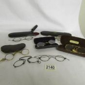 A mixed lot of vintage spectacles, pince nez and lorgnettes.