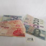 A mixed lot of Asian bank notes including Thai.