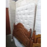 A double bed and headboard