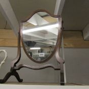 A Victorian mahogany shield shaped mirror.