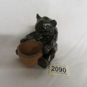 A rare Doulton Lambeth bear with honey pot (repair to ear).