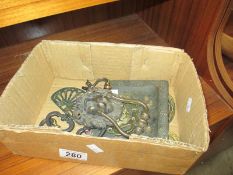 A small box of lions head brass door knocker, handles etc.