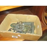 A small box of lions head brass door knocker, handles etc.