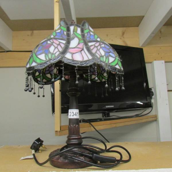 A table lamp with Tiffany style shade.