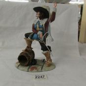 A royal Doulton Cavalier figurine.