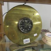 A 1930's Noal & Sons Ltd., car clock in trench art case.