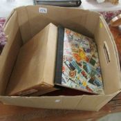 A box of stamp albums etc.