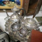 A 4 piece silver plate tea set on tray.