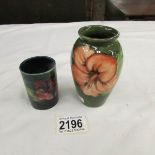 2 small Moorcroft vases.