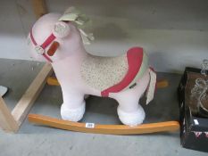 A Mamas and Papas Pink rocking horse