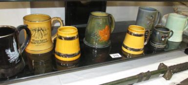 A quantity of Wade tankards