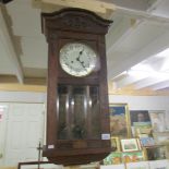 An oak wall clock.