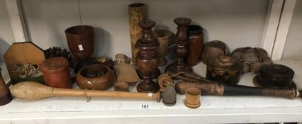 A collection of wooden items including candlesticks, vases etc.