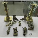 A collection of antique brass 2 knockers and other brass items.