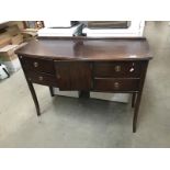 A dark wood stained sideboard