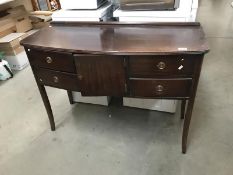 A dark wood stained sideboard